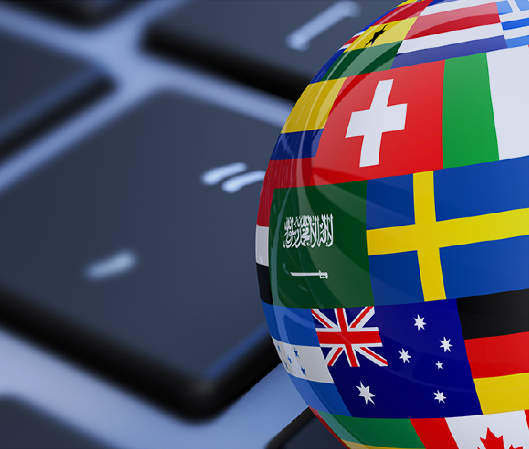 Globe with flags on computer keyboard